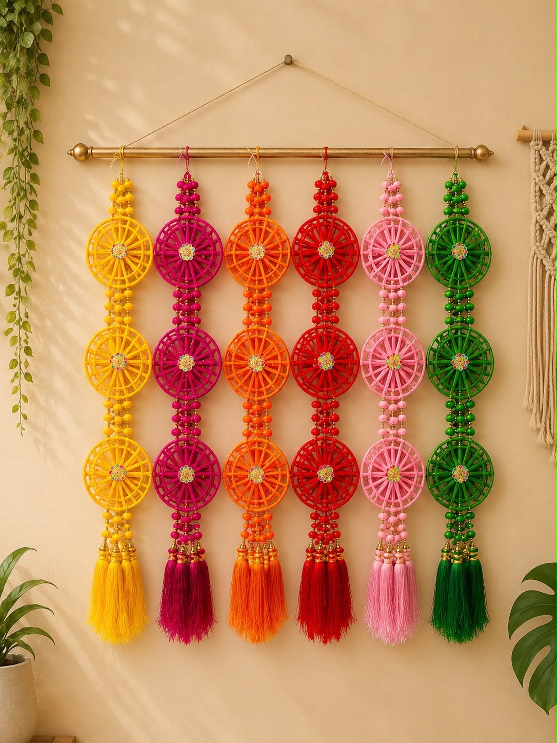 Multicolour woven wheel Diwali toran with beaded strands and tassels in yellow, magenta, orange, red, pink and green