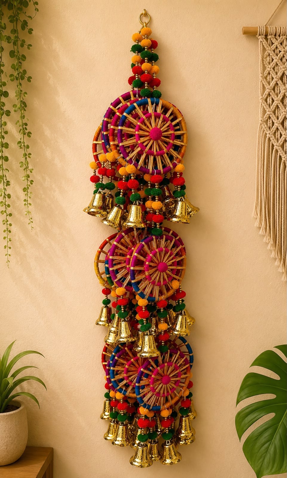 Multicolour woven wheel Diwali door hanging with pom-poms, beads and hanging brass bells