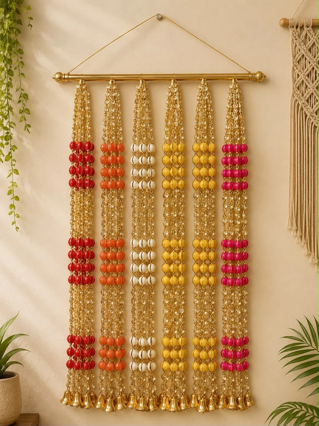 Multicolour beaded Diwali toran with red, orange, white, yellow and pink beads, gold chains and hanging bells
